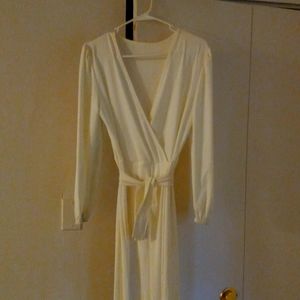 Pearl colored one piece flair out pants suit
